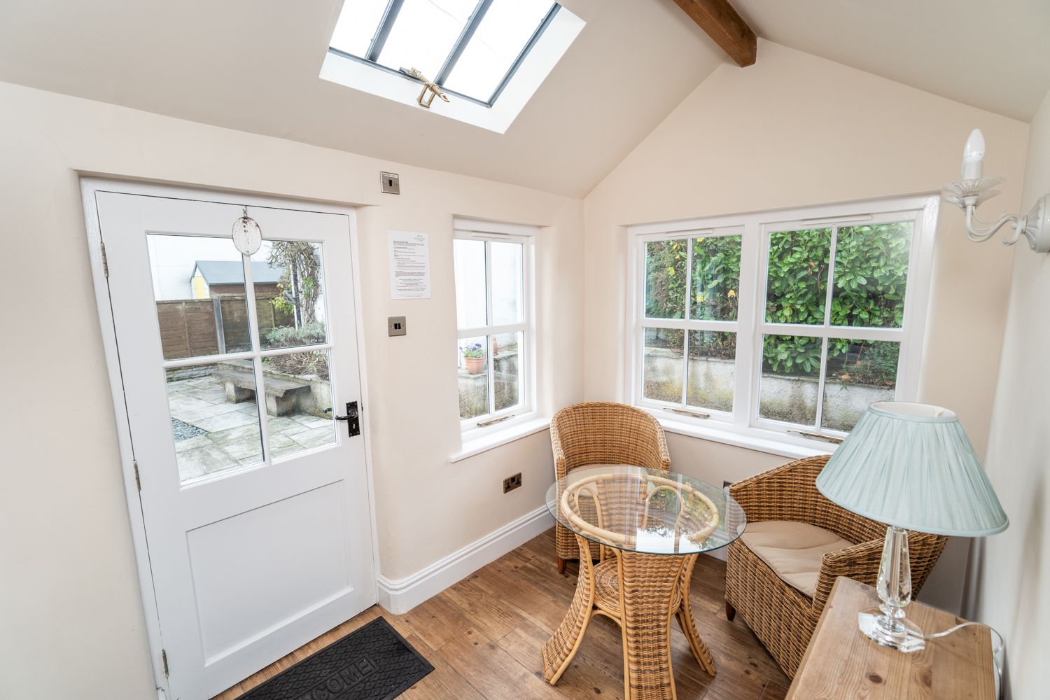 Enjoy breakfast in the sun room, or relax here with a good book