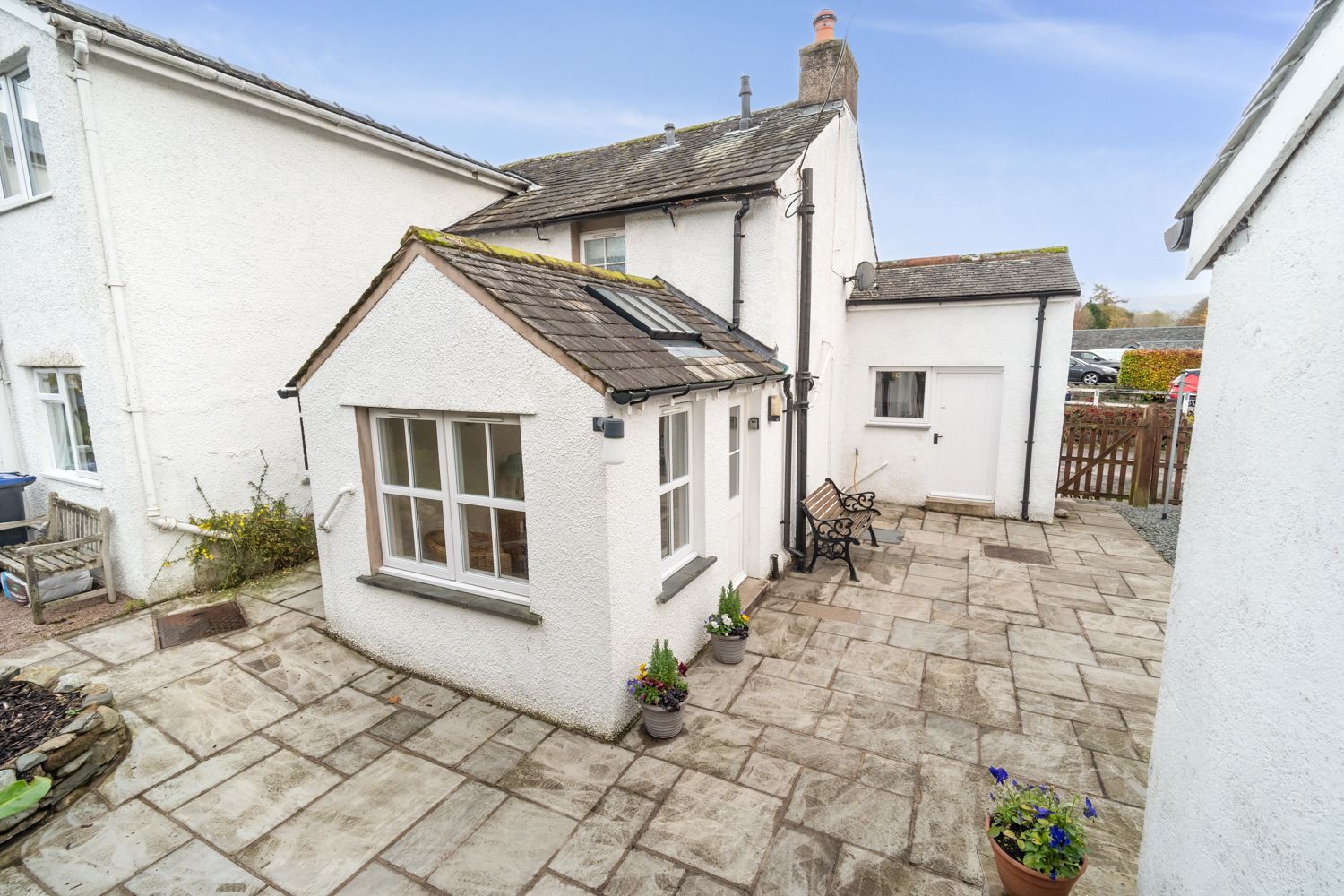 Here you can see the sun room from he rear of the property, the utility area can be found in the small outbuilding on the right hand side