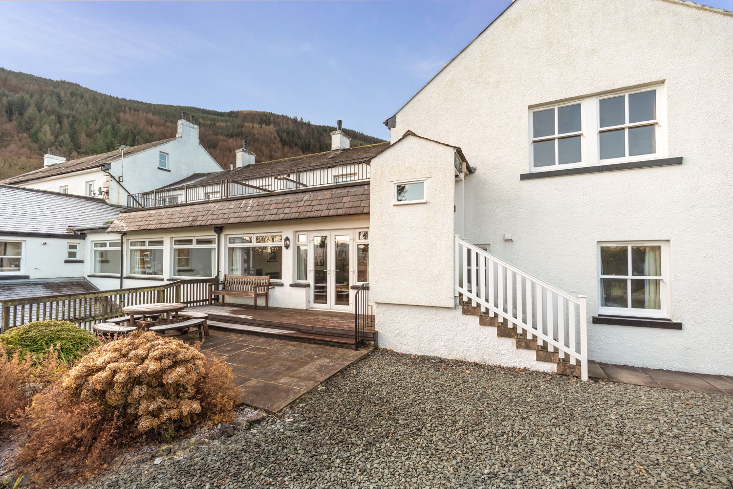 The cottage is accessed via the outdoor steps at the rear of the property