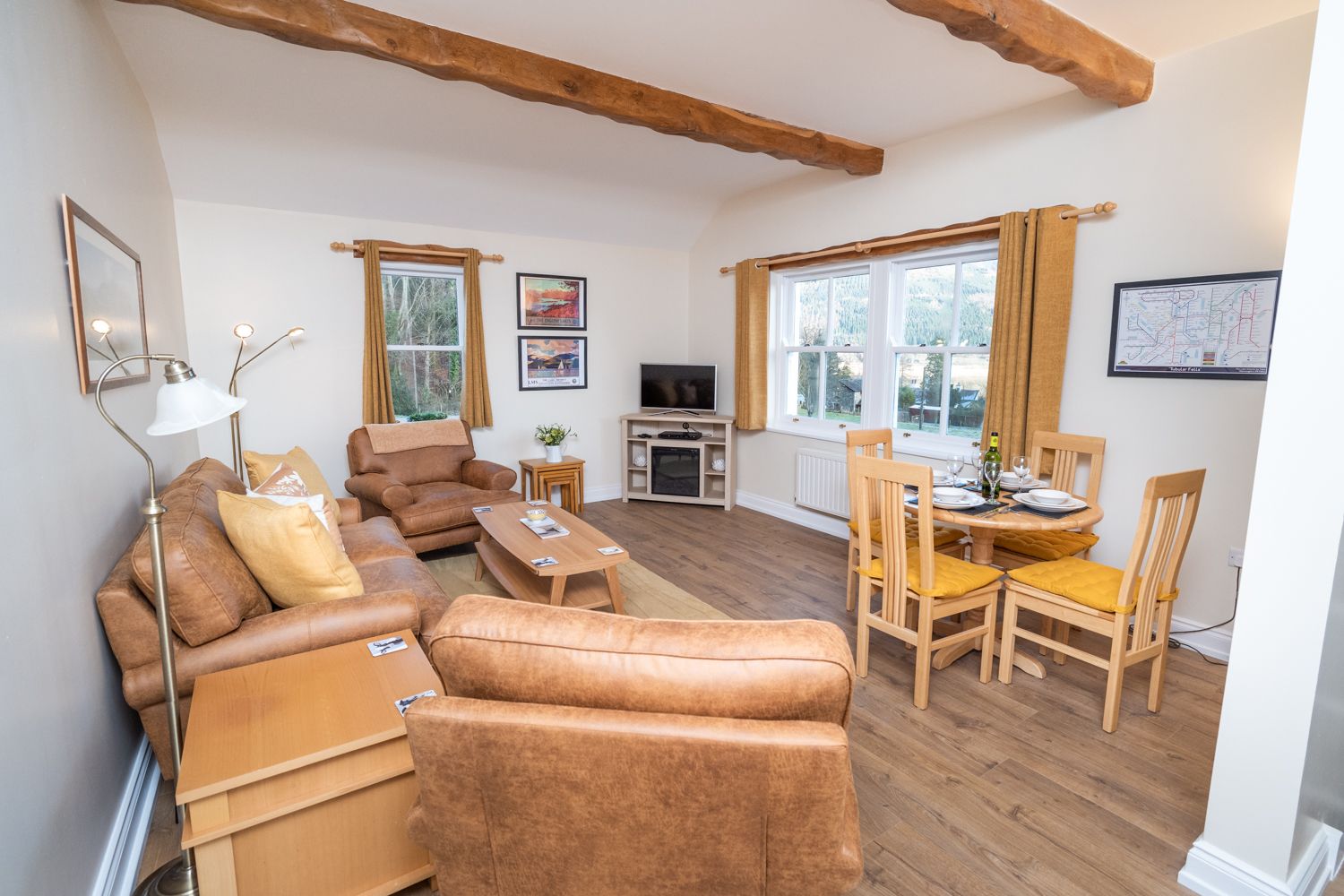 The lovely open plan living and dining area has gorgeous views over the garden