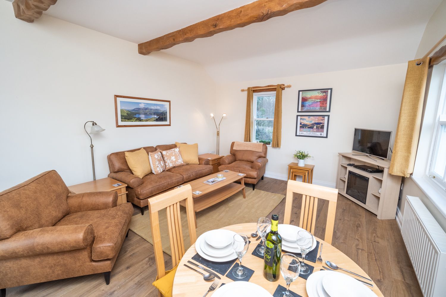 The property retains some original features like the exposed wooden beams