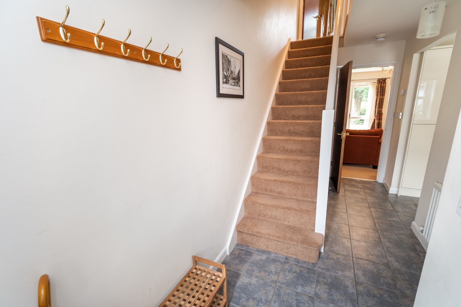 The front door leads into the hallway, which is spacious enough to store bags, boots and coats