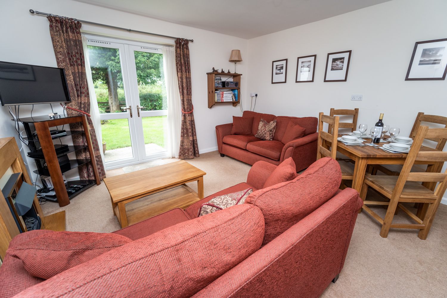 The living and dining area enjoy beautiful garden views