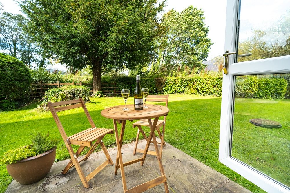 The property shares a gorgeous garden with the surrounding properties, outdoor furniture is provided so that you can sit out and enjoy this space