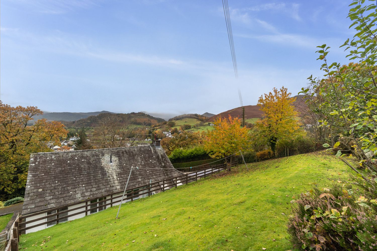 At the rear of the property is a steep lawn, from where you will enjoy exceptional views of the surrounding area