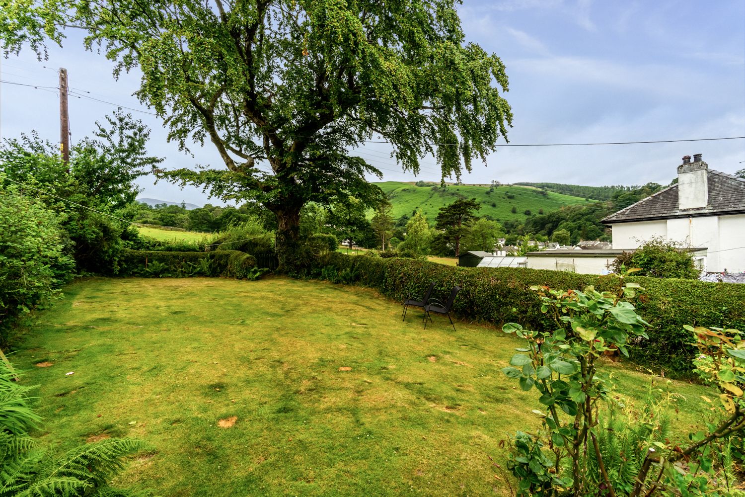 A beautifully spacious rear garden is the perfect spot to relax on a Summers day