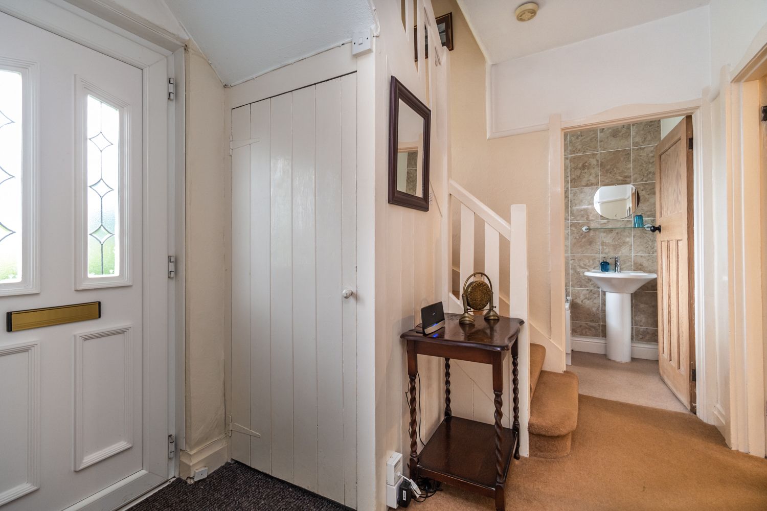 The front entrance leads into the downstairs hallway