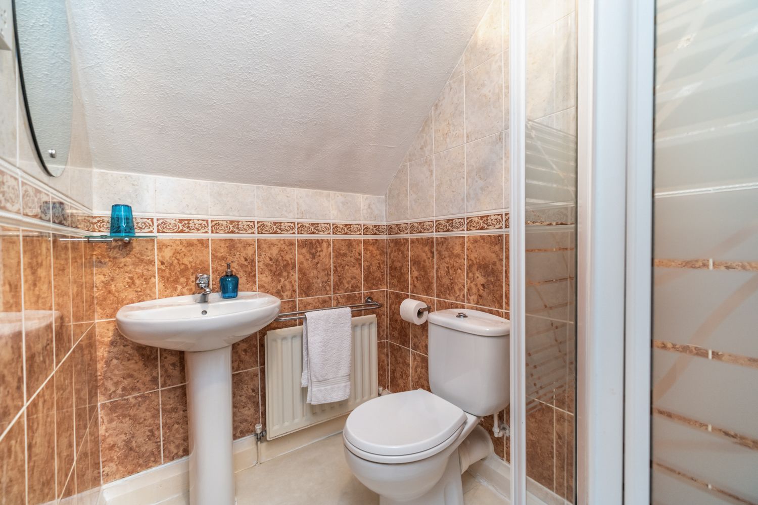 The ensuite shower room is found off the twin bedroom at the rear of the property