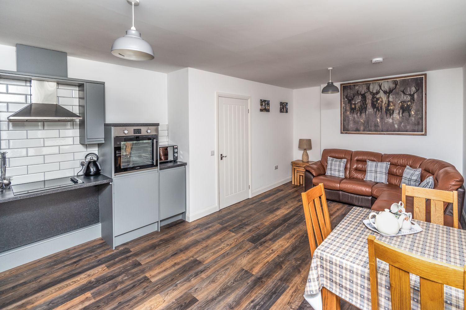 The open plan living/dining and kitchen area is spacious and tastefully decorated