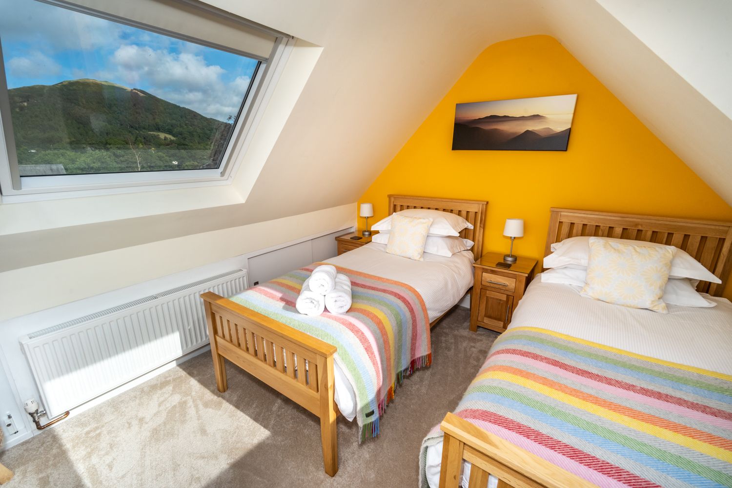 The twin bedroom is bright and airy and has incredible views on either side