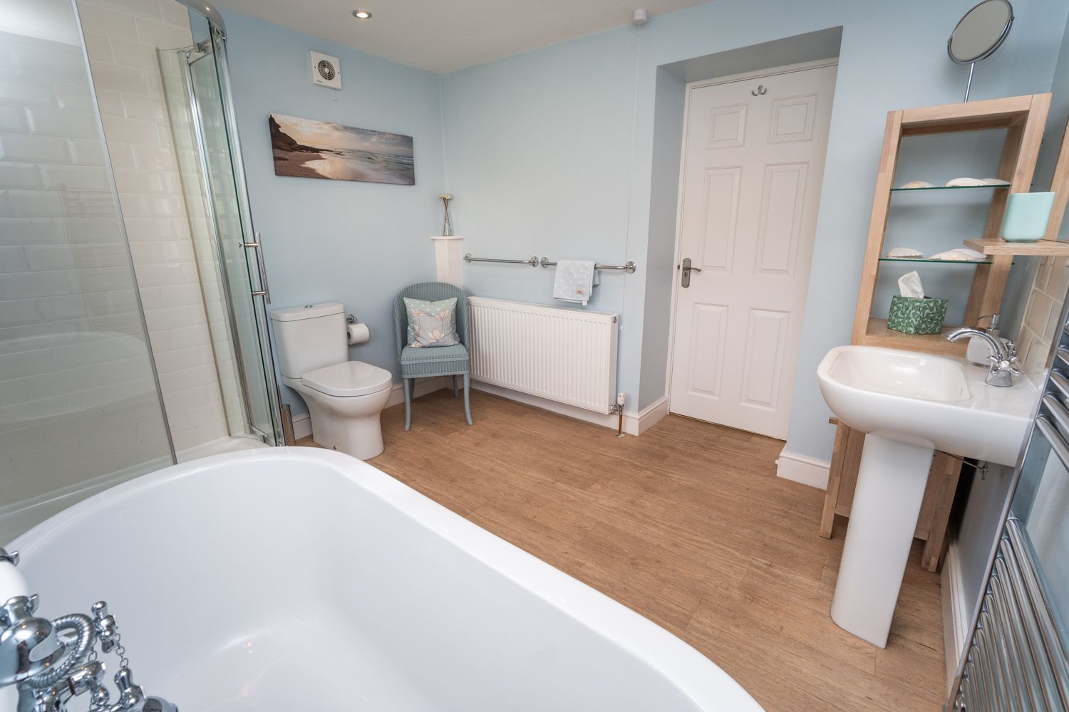 The bathroom is beautifully decorated and features a roll top bath, perfect if you are travelling with children