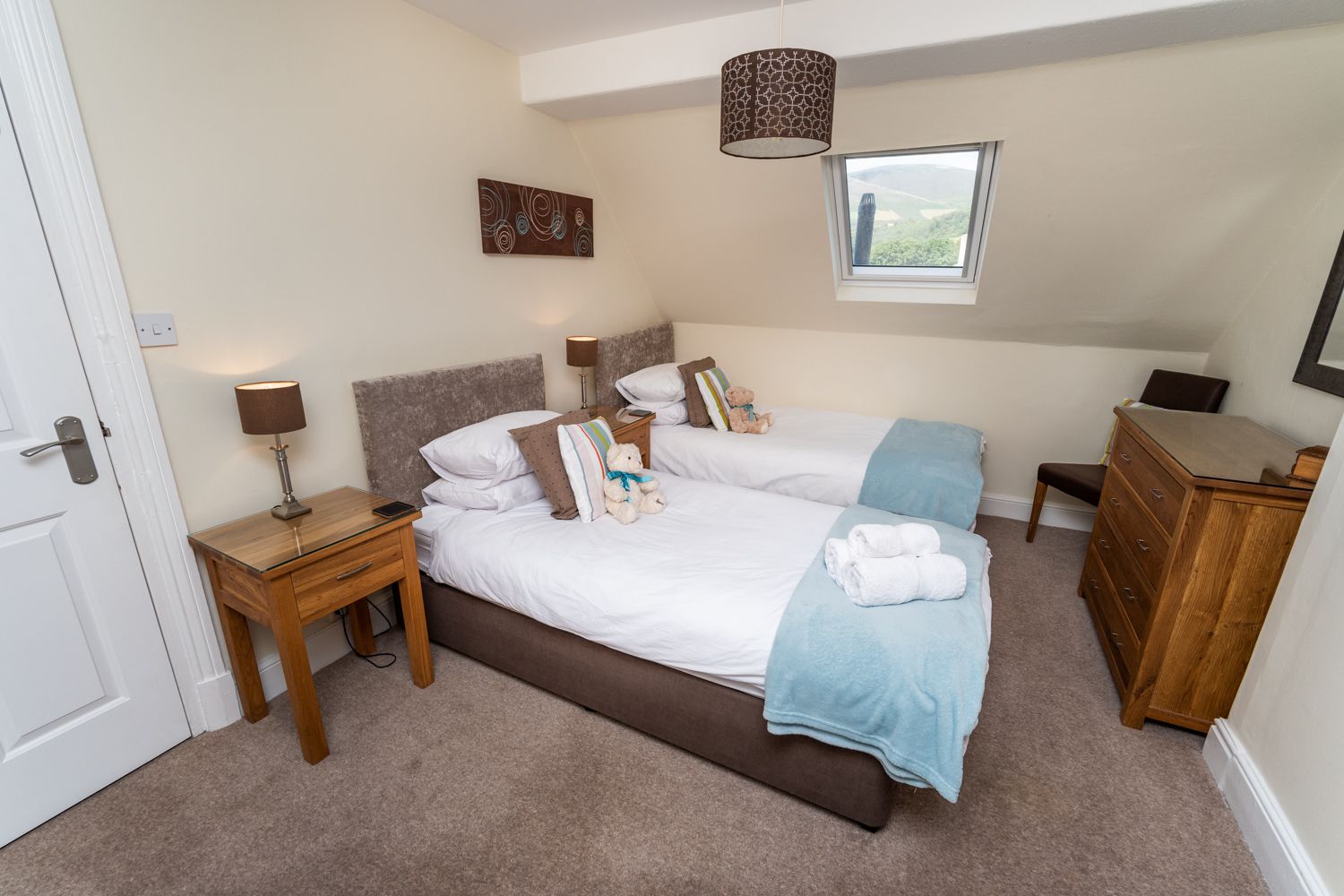 You can find a twin bedroom on the top floor of the property