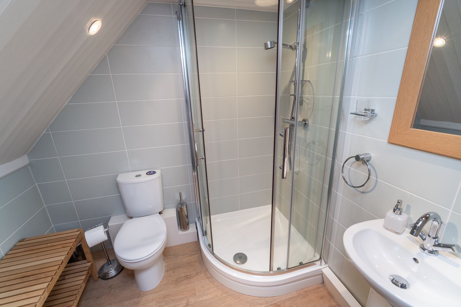 The ensuite bathroom to the master bedroom comprises a walk in shower, WC and hand basin