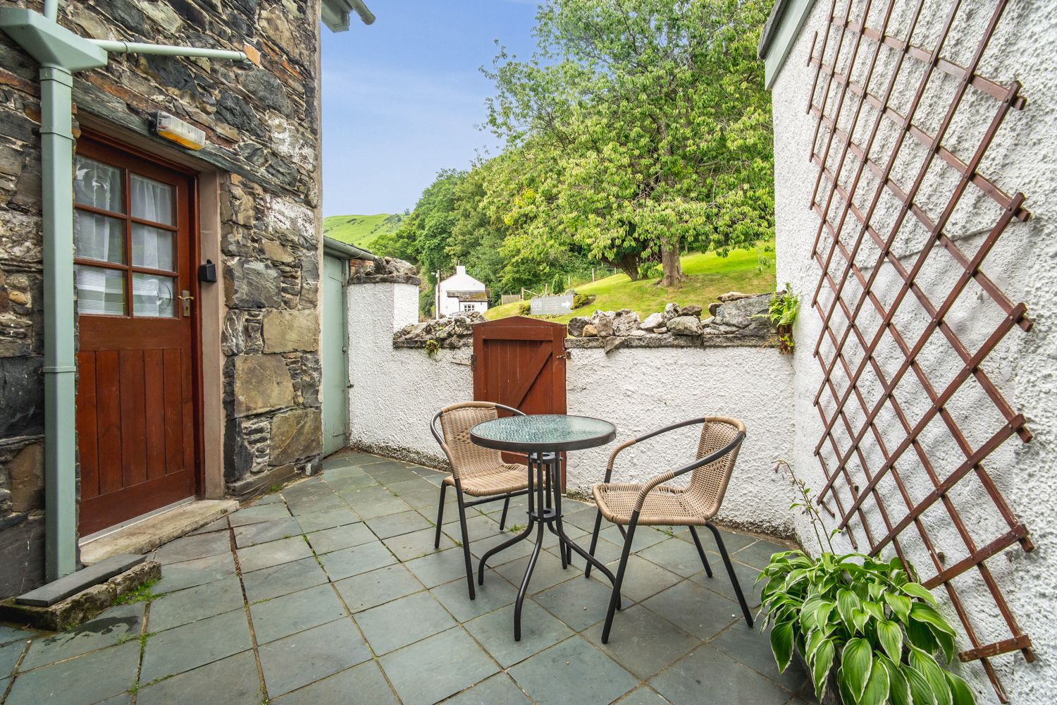 At the rear of the property is a lovely patio and seating area with access to the kitchen