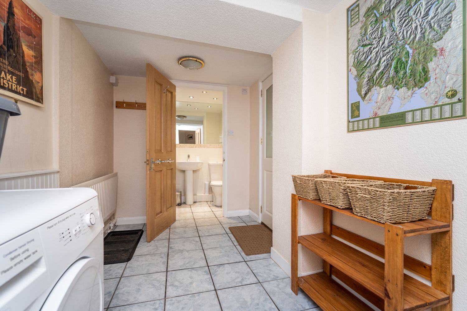 Towards the rear of the property is a large utility area, there is access to the street from here through the back door