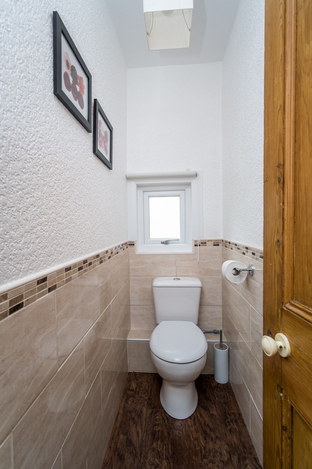 The toilet can be found adjacent to the bathroom