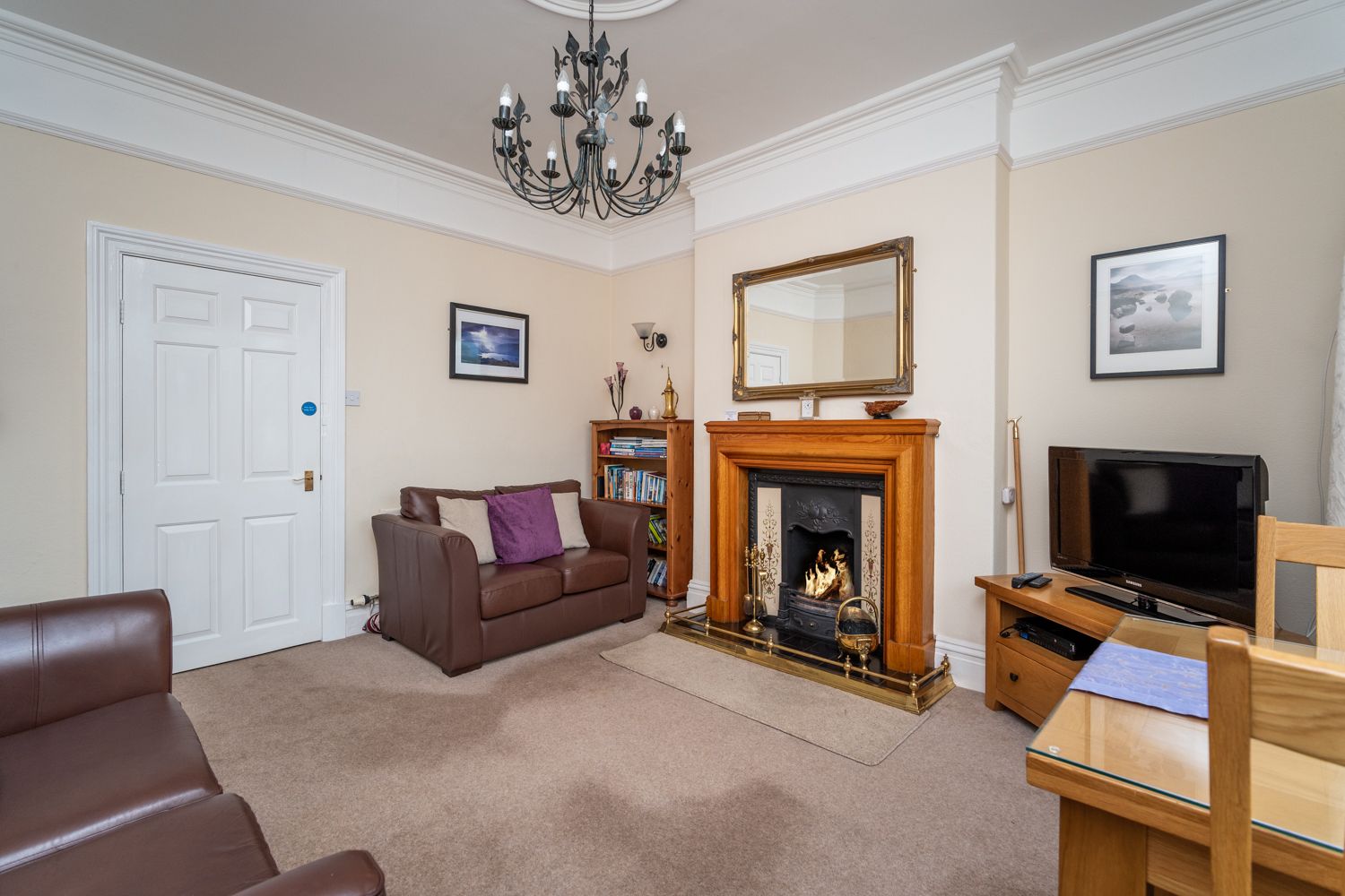 The warm and cosy living and dining area has a lovely open fire that can be enjoyed on colder days
