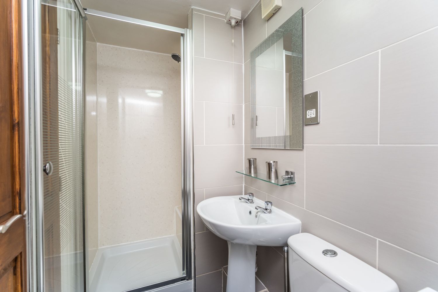 The compact shower room is found on the ground floor