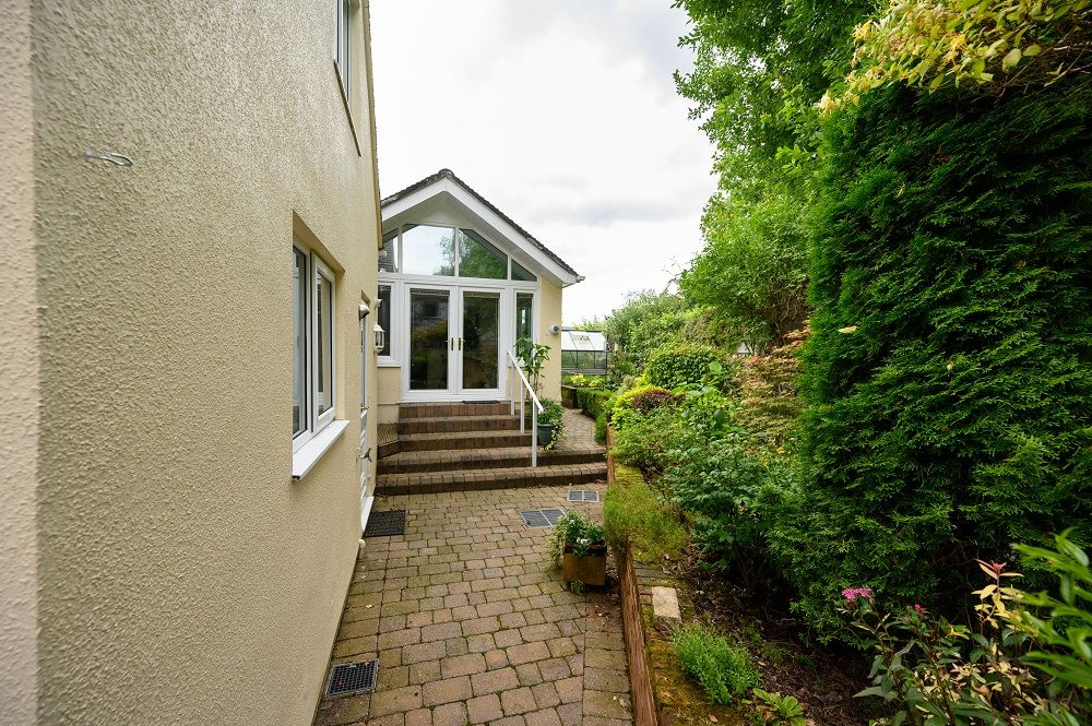 Follow the stairs through the French doors and you will enter the dining and kitchen area