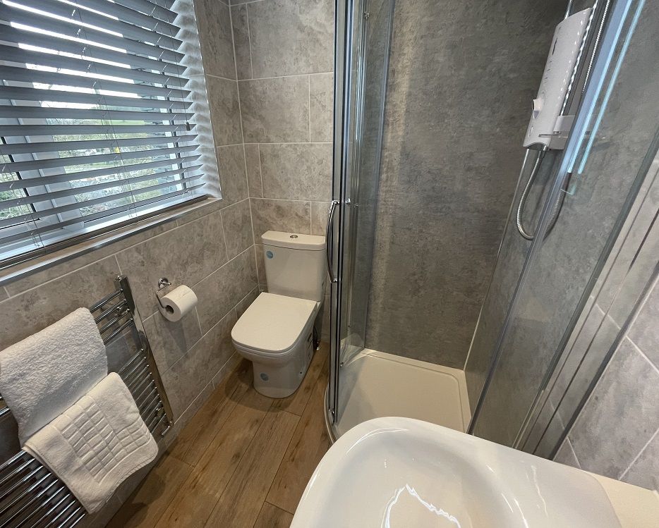 The front bedroom benefits from an ensuite shower room