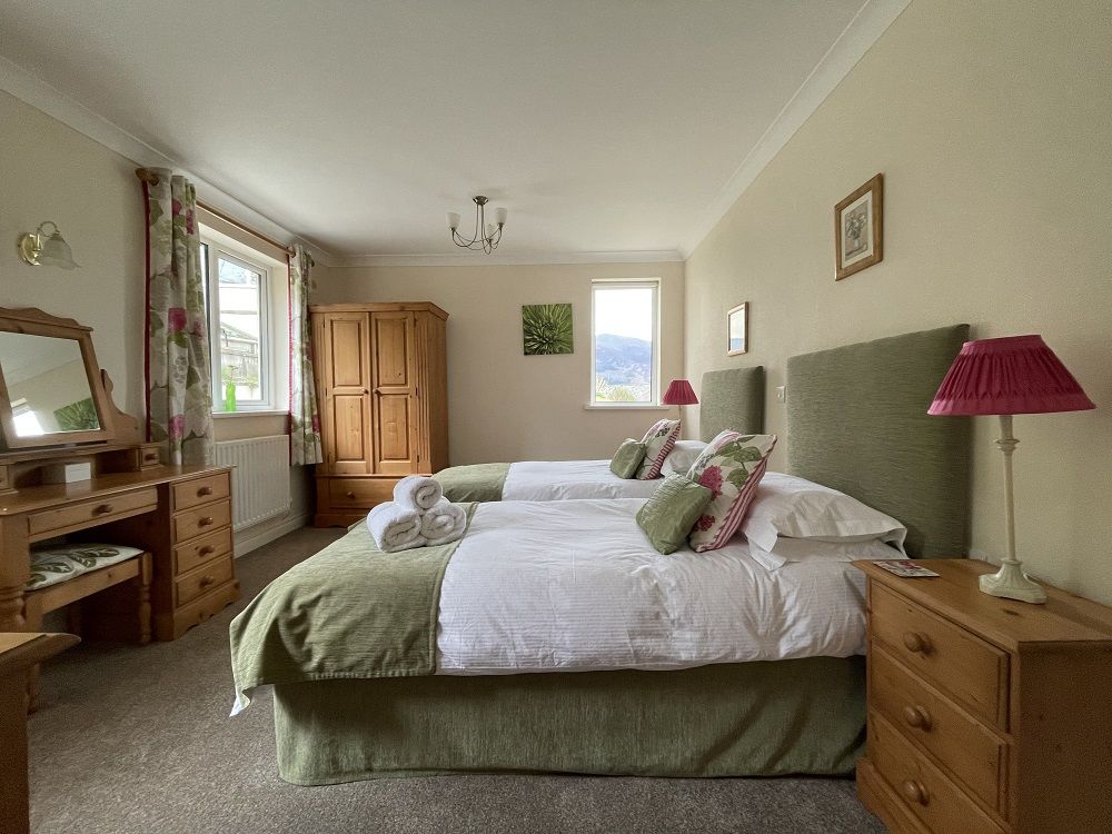 The second bedroom has dual aspect windows and lovely views