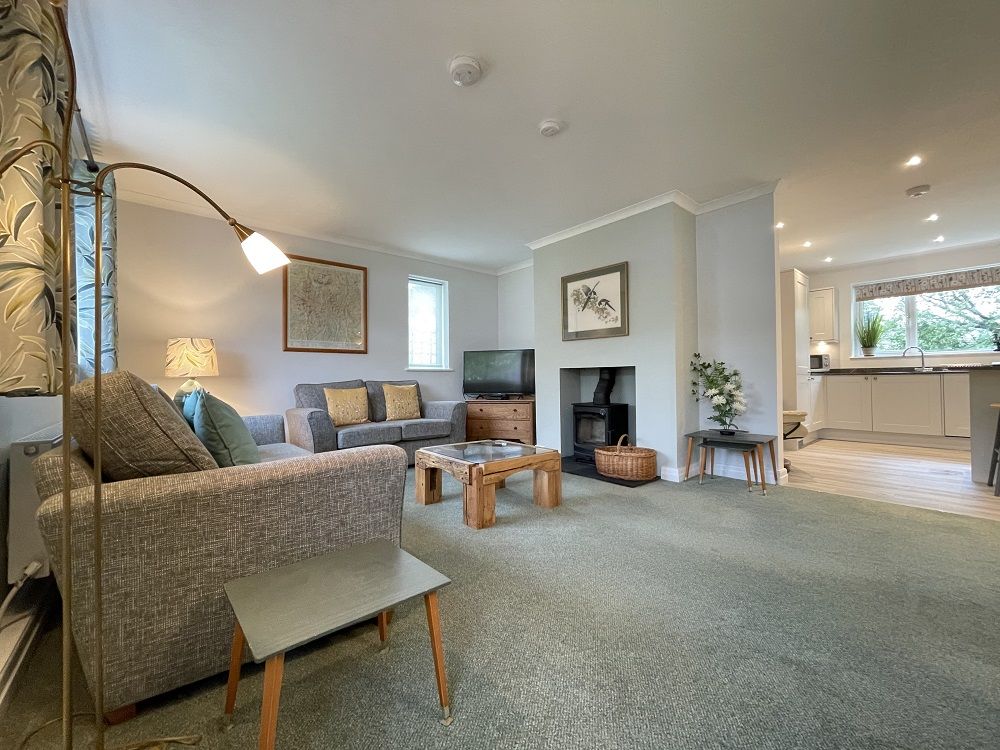 You will find 2 comfortable sofas and easy chair to relax in 