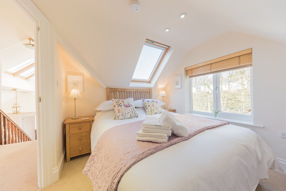 Upstairs you will find another double bedroom with king sized bed