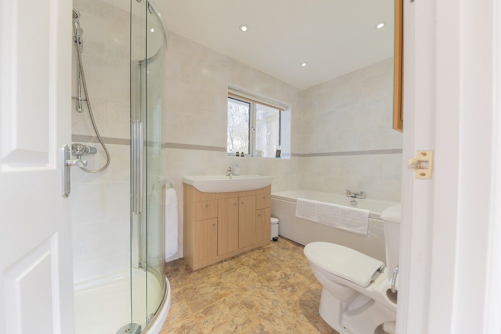 The family bathroom is spacious and comprises of a bath, separate walk in shower, WC and hand basin