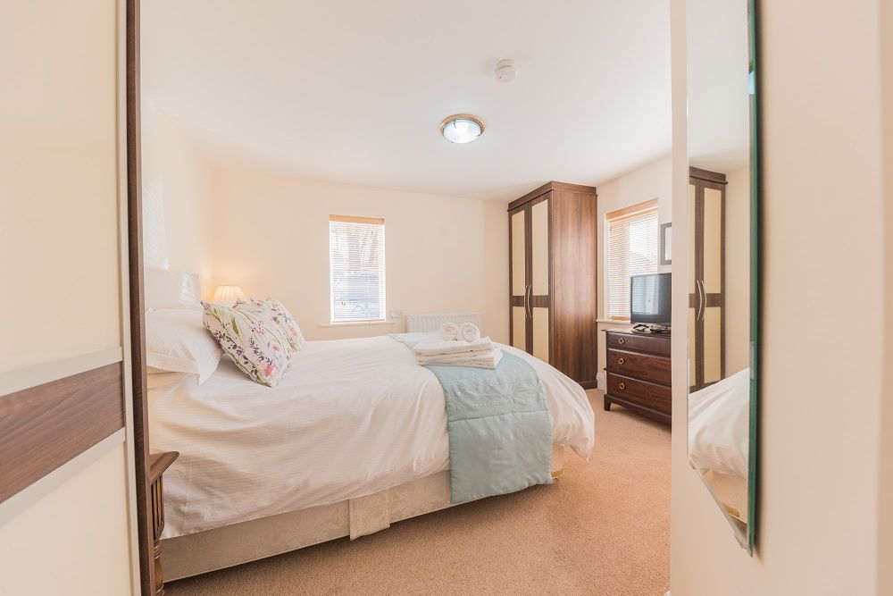 The ground floor bedroom has a comfortable king sized bed