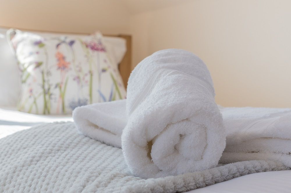 Towels and luxury bed linen are provided