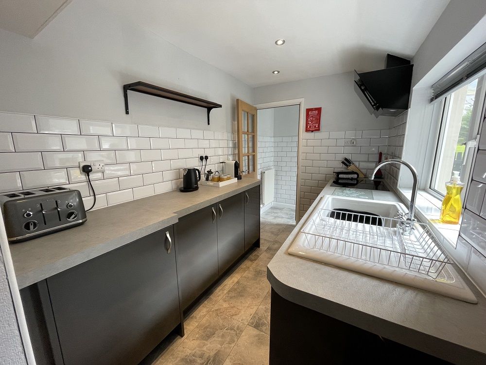 The modern galley kitchen is found at the rear of the property