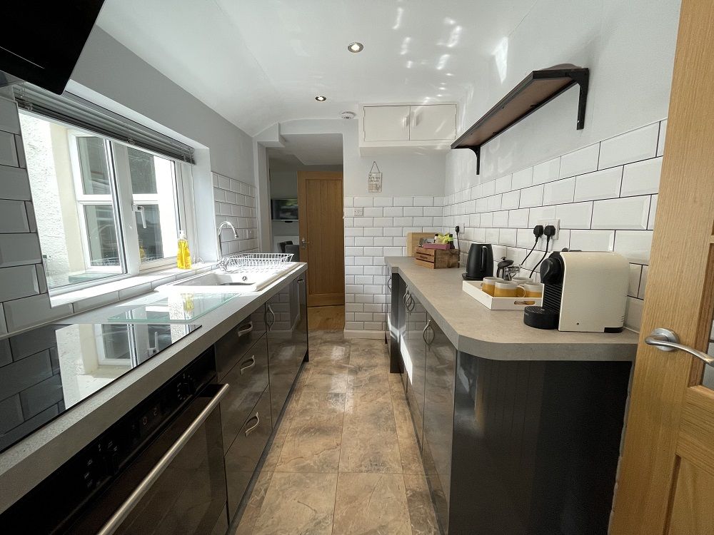 The kitchen is equipped with everything that you need for your stay including electric hob and oven, toaster and microwave and even a Nespresso machine