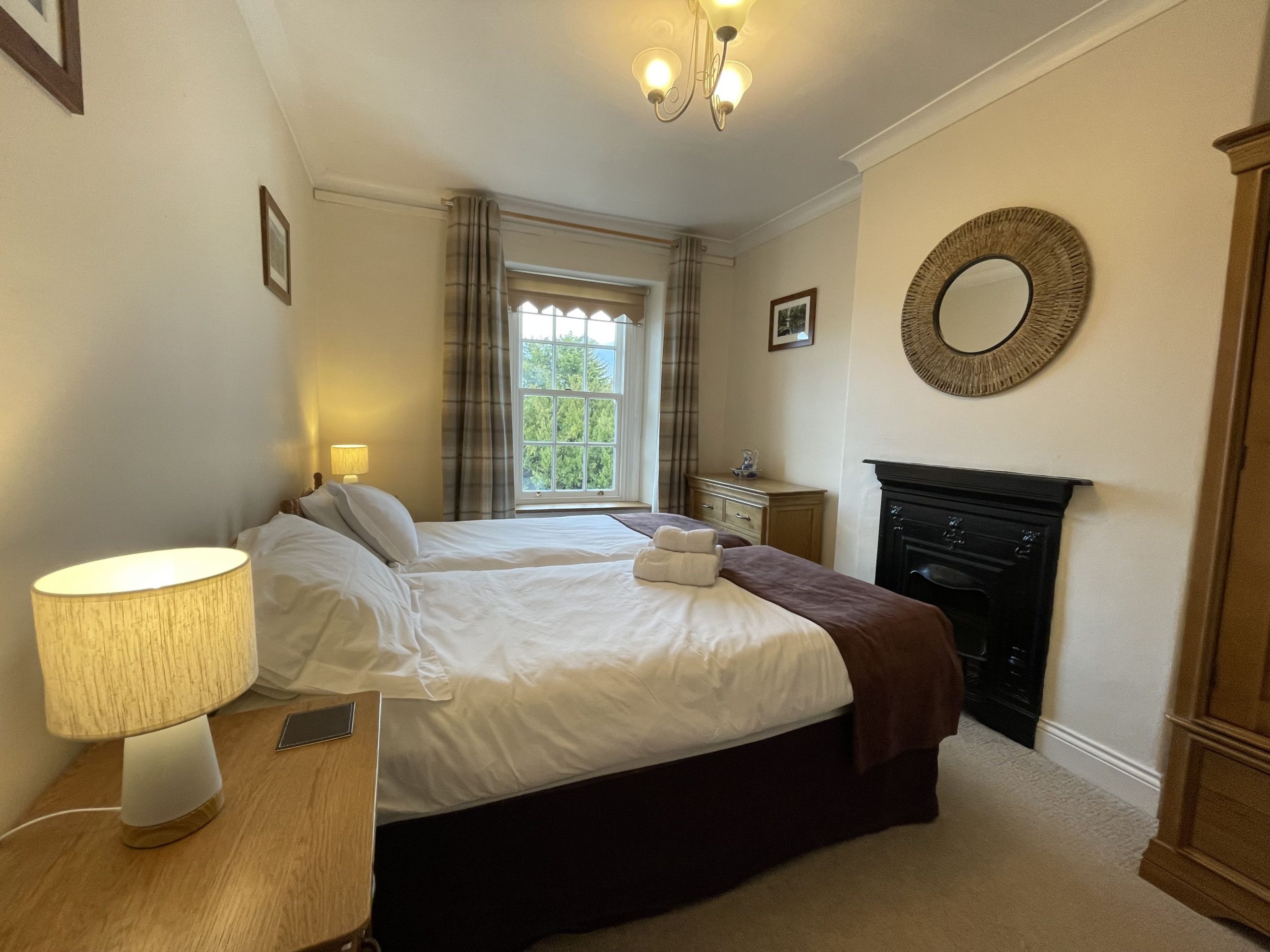 The second bedroom features two single beds
