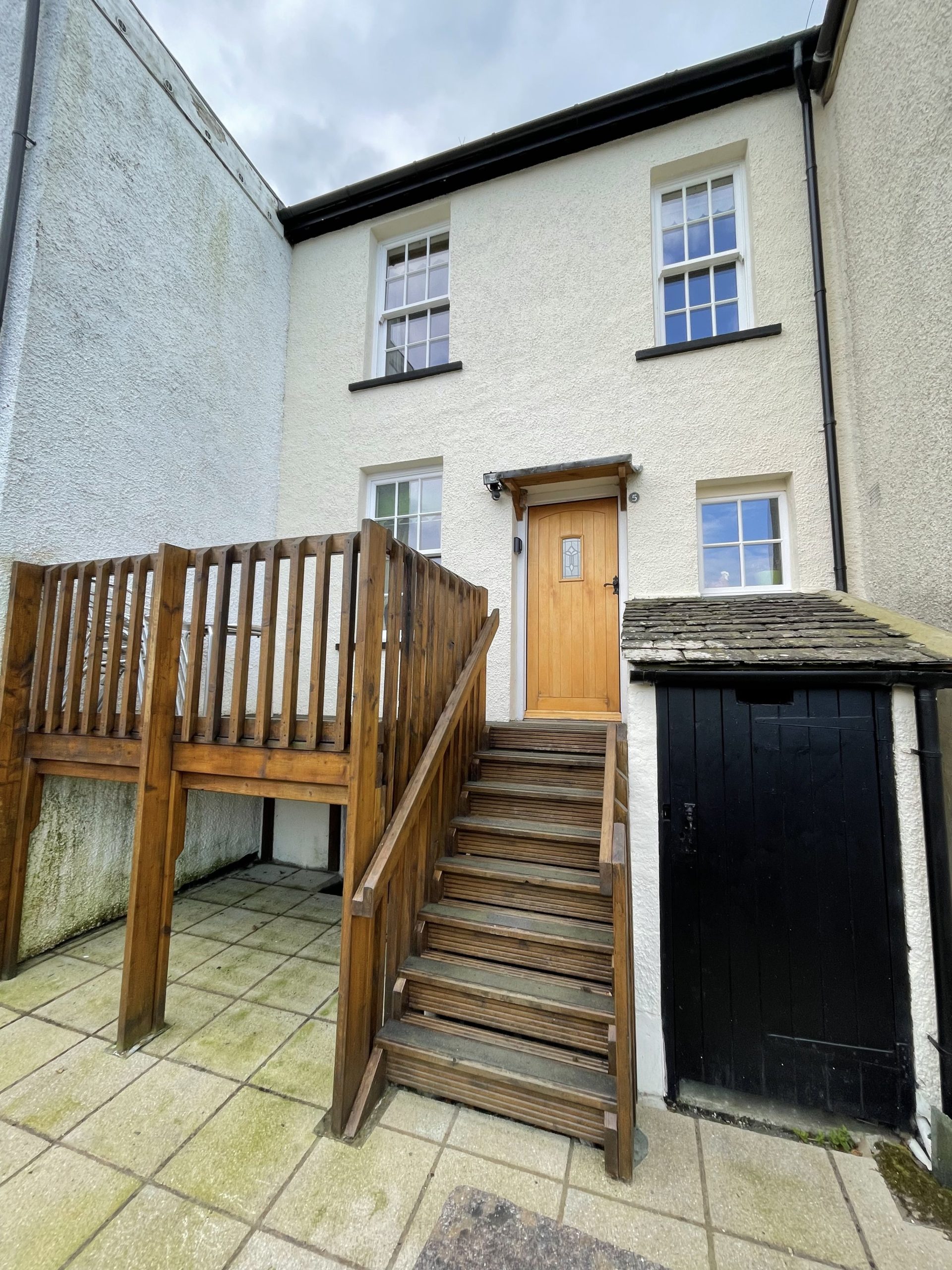 Tawny Cottage has a delightful elevated patio area leading to the back door of the property, which is used as the main entrance