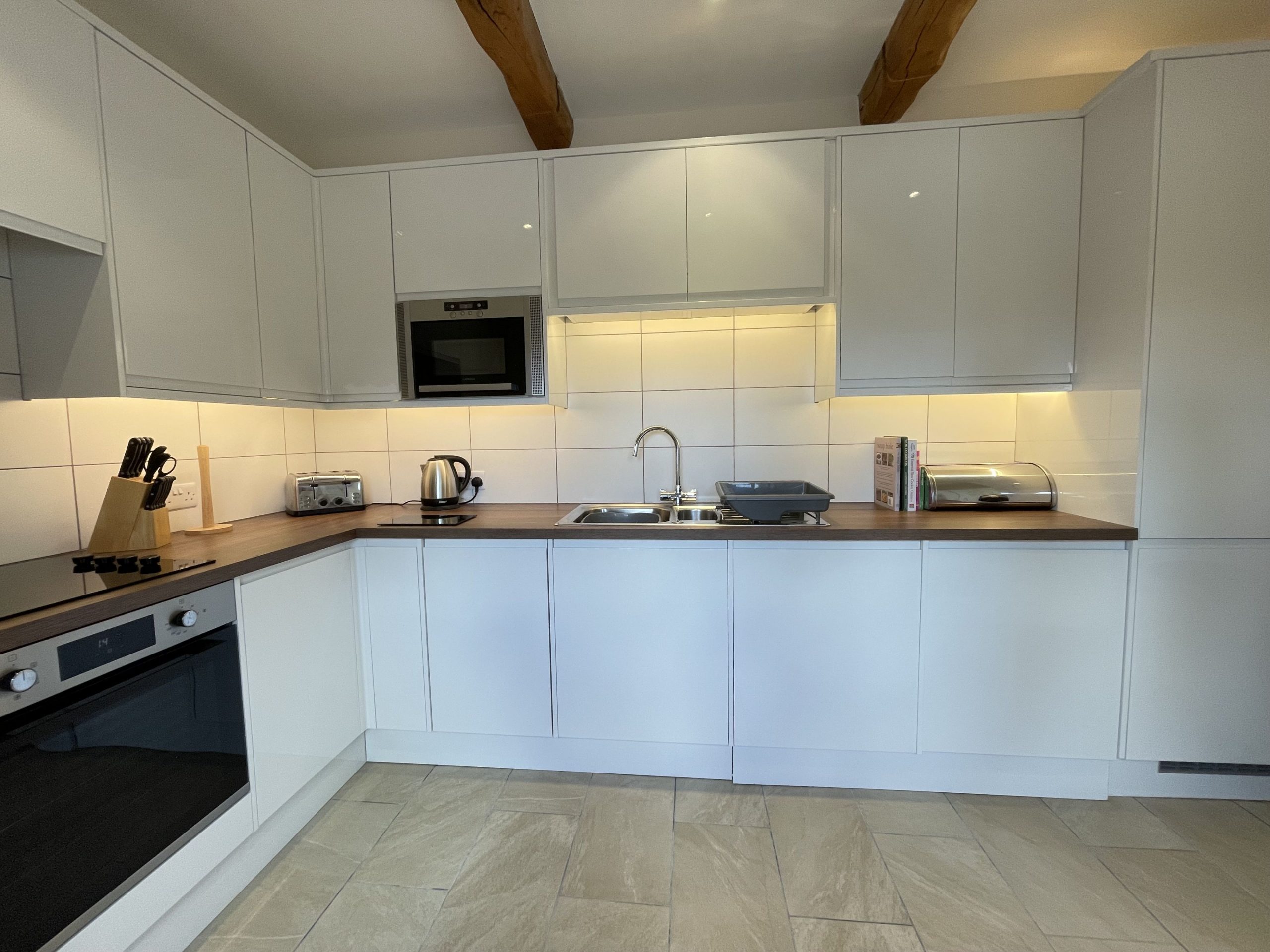 The recently fitted kitchen comes fully fitted with a fridge-freezer, dishwasher, electric oven and hob, a microwave, a washing machine, tumble dryer and a selection of cookbooks