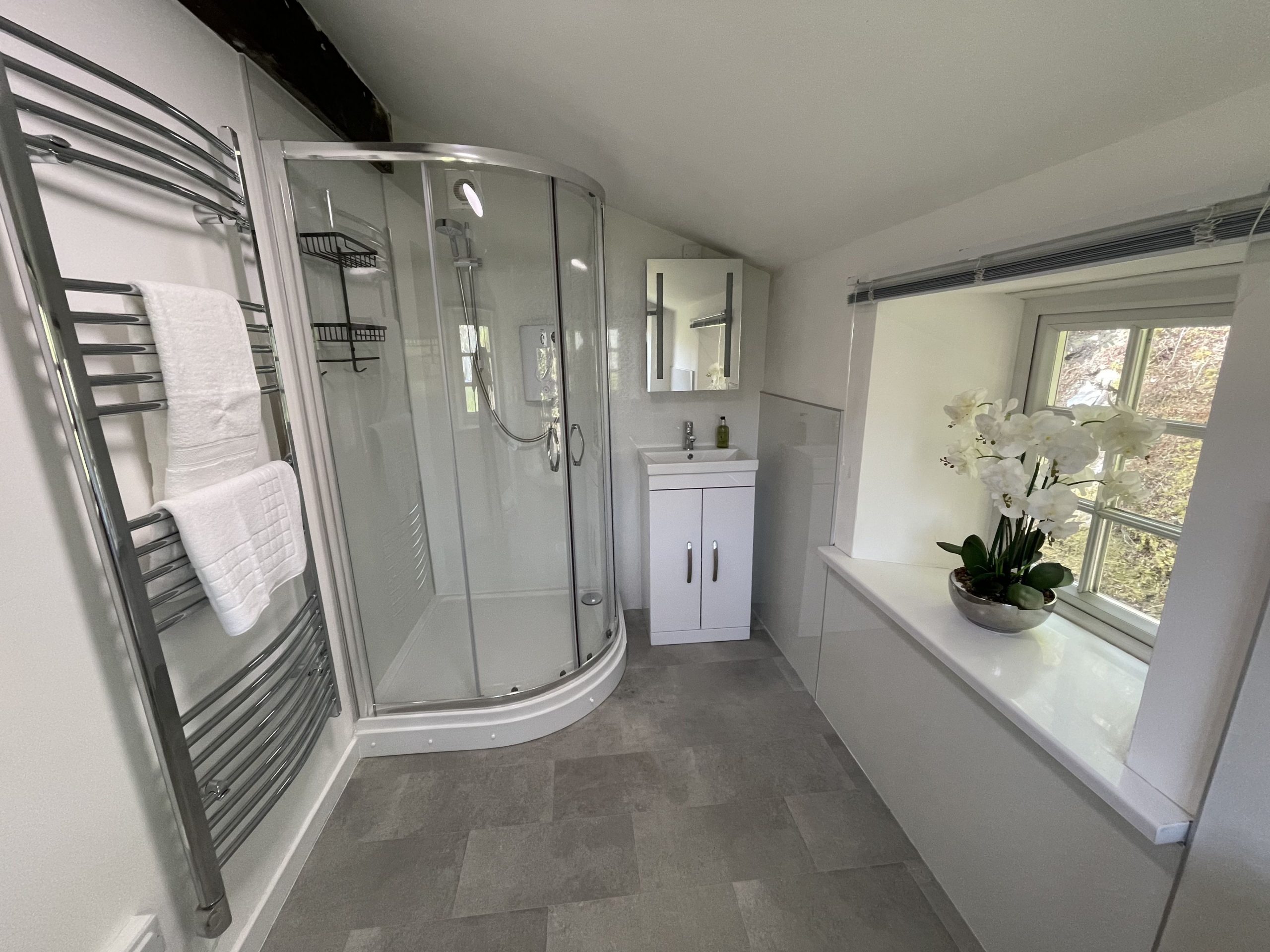 The master bedroom has an ensuite shower room