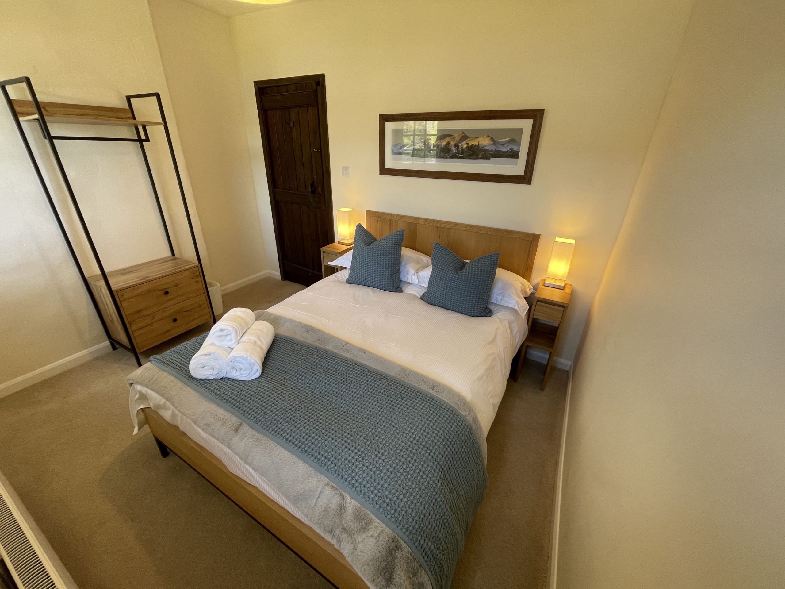 The third bedroom features a double bed and space to hang clothes