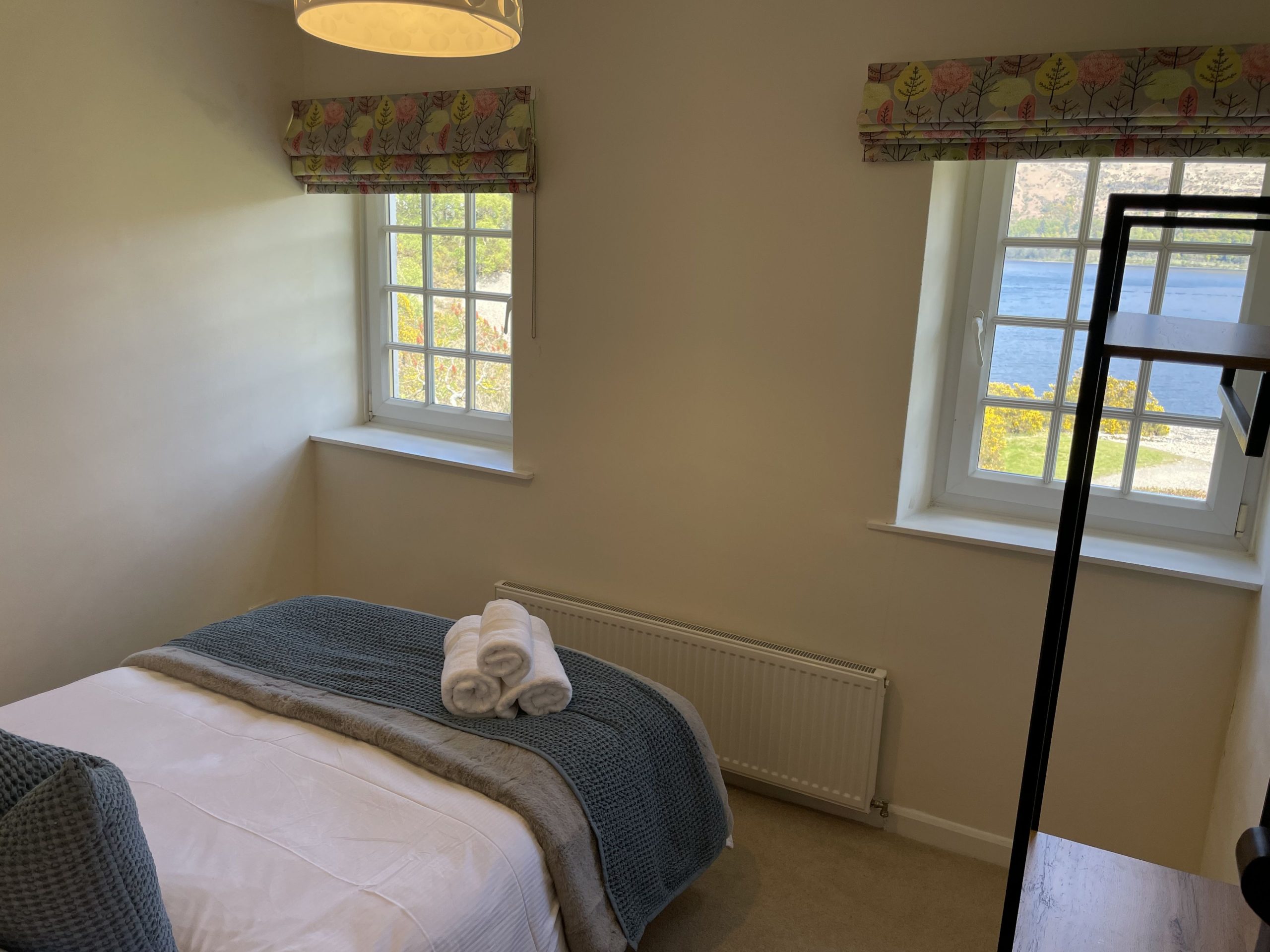 This double bedroom has incredible views of the lake and surrounding fells