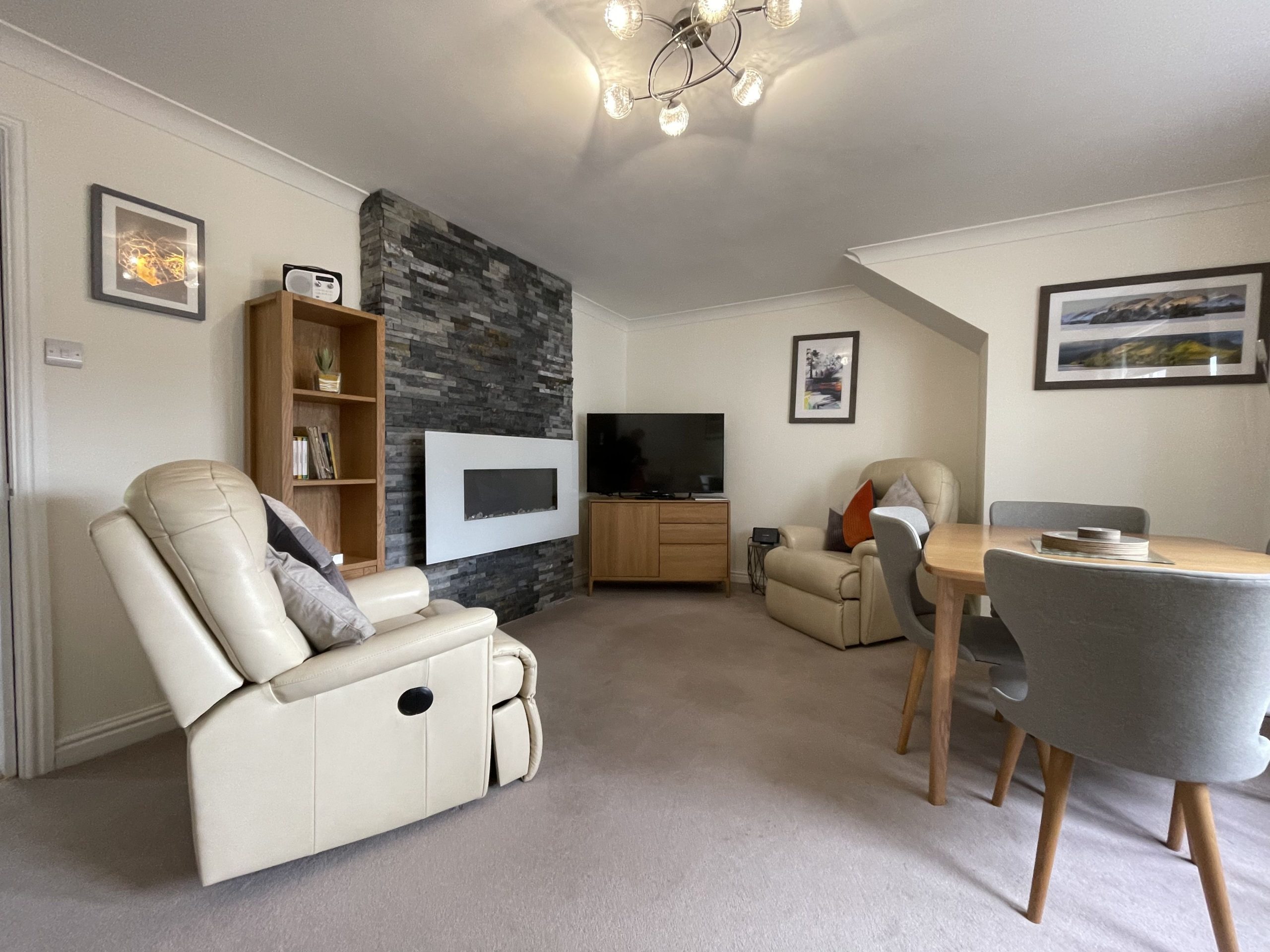 The living and dining area is at the rear of the property