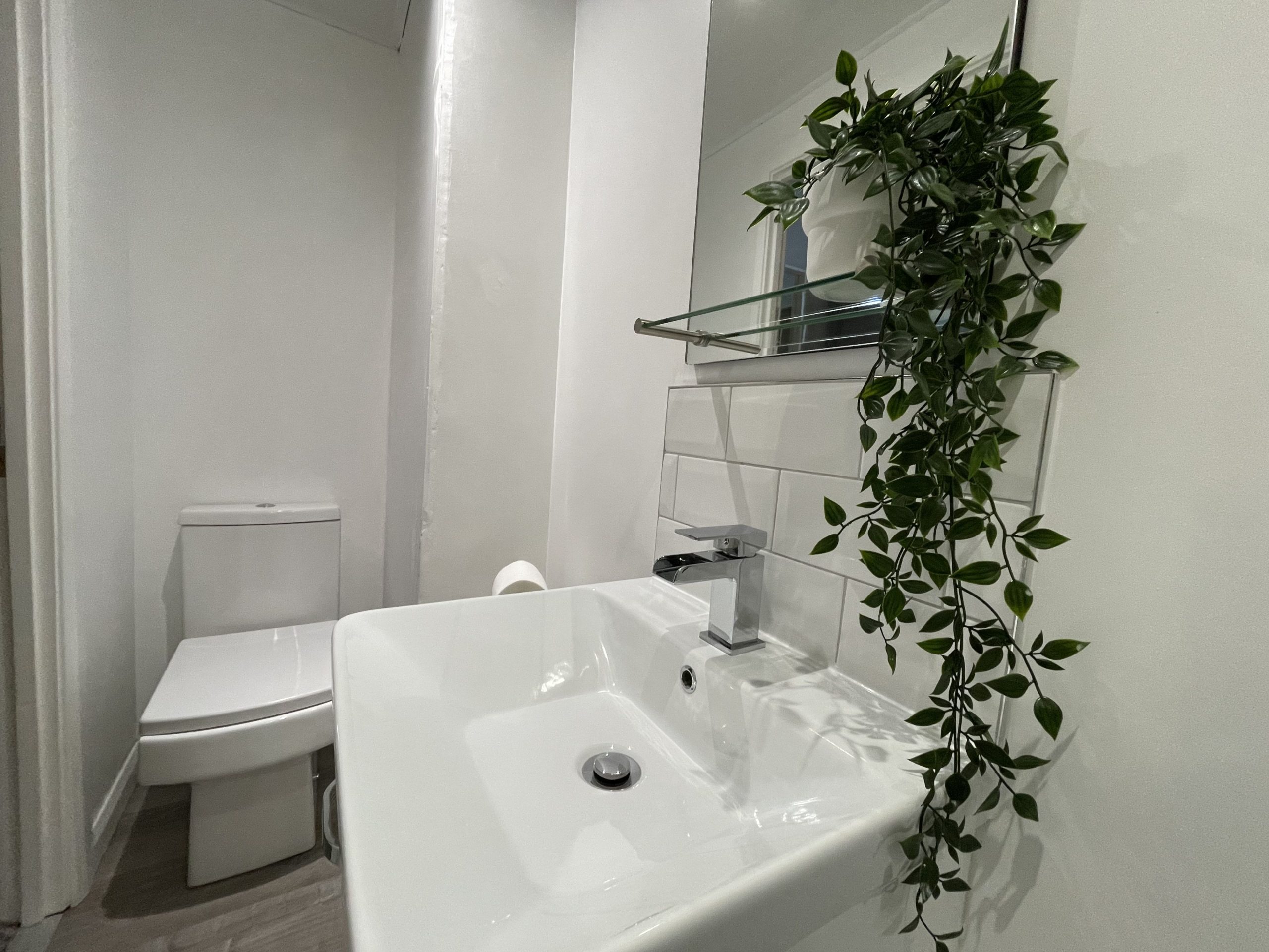 The ensuite comprises walk in shower, WC and hand basin