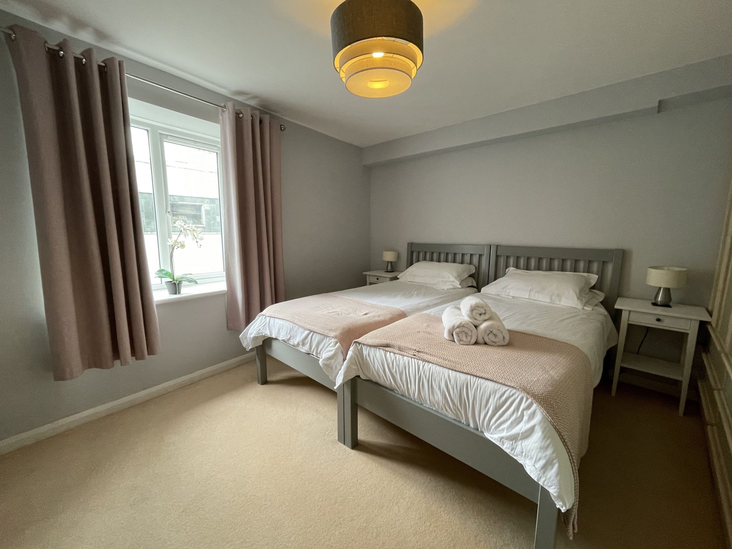 A delightful and spacious twin bedroom