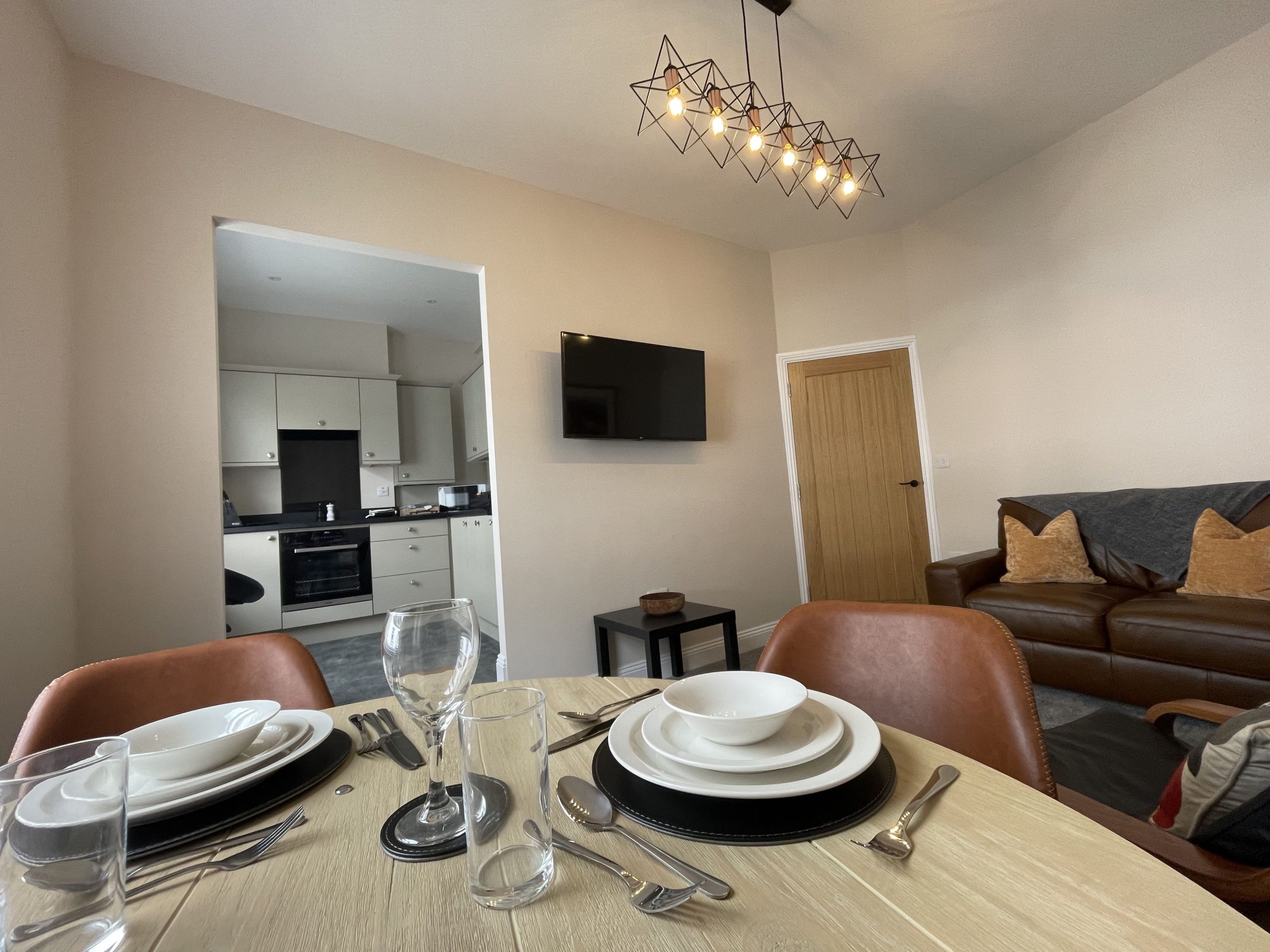 The dining table is positioned next to the window so you can enjoy the view whilst tucking in to a delicious meal.