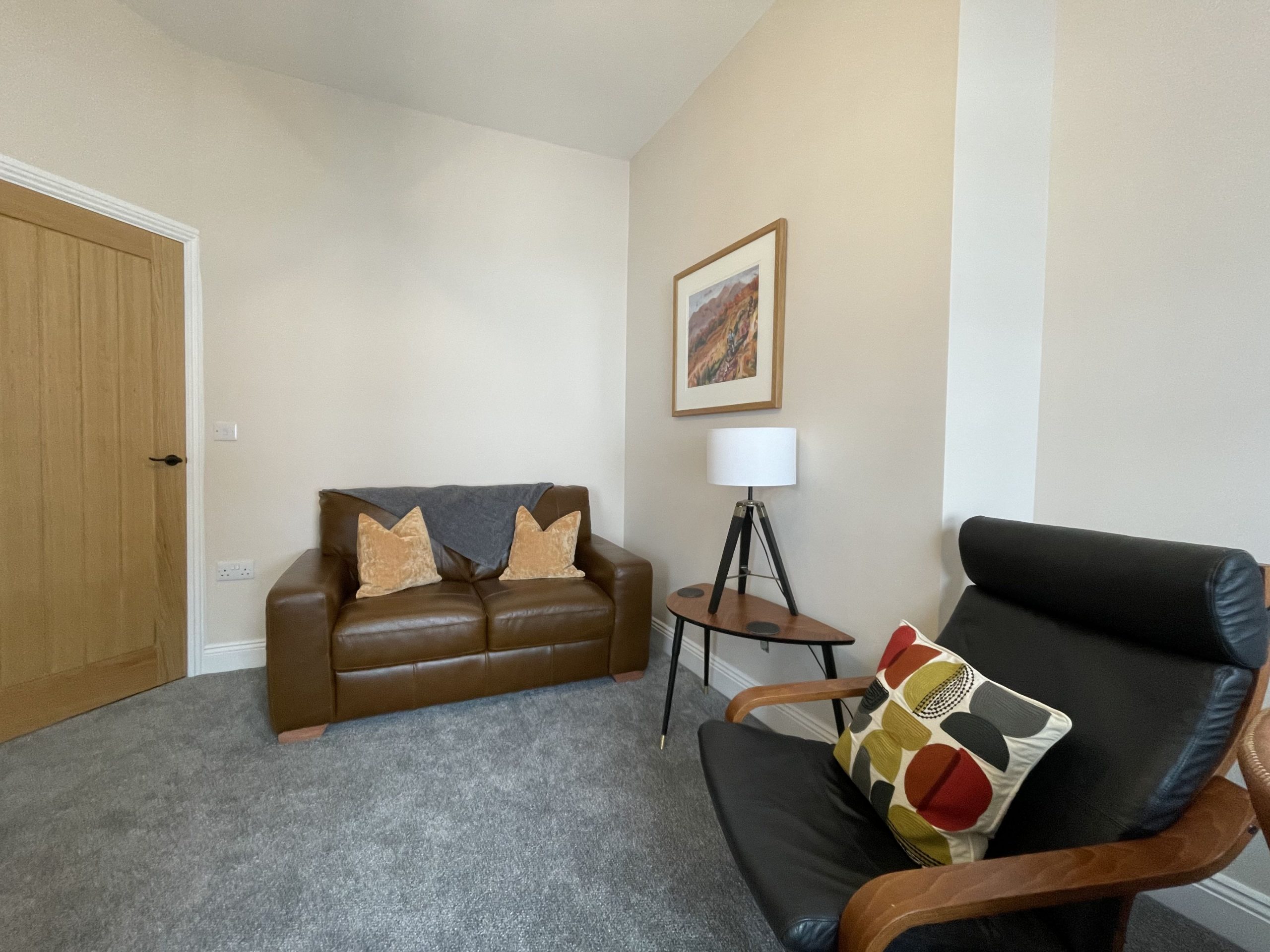 Super comfortable leather sofa and easy chair to enjoy after a long day.