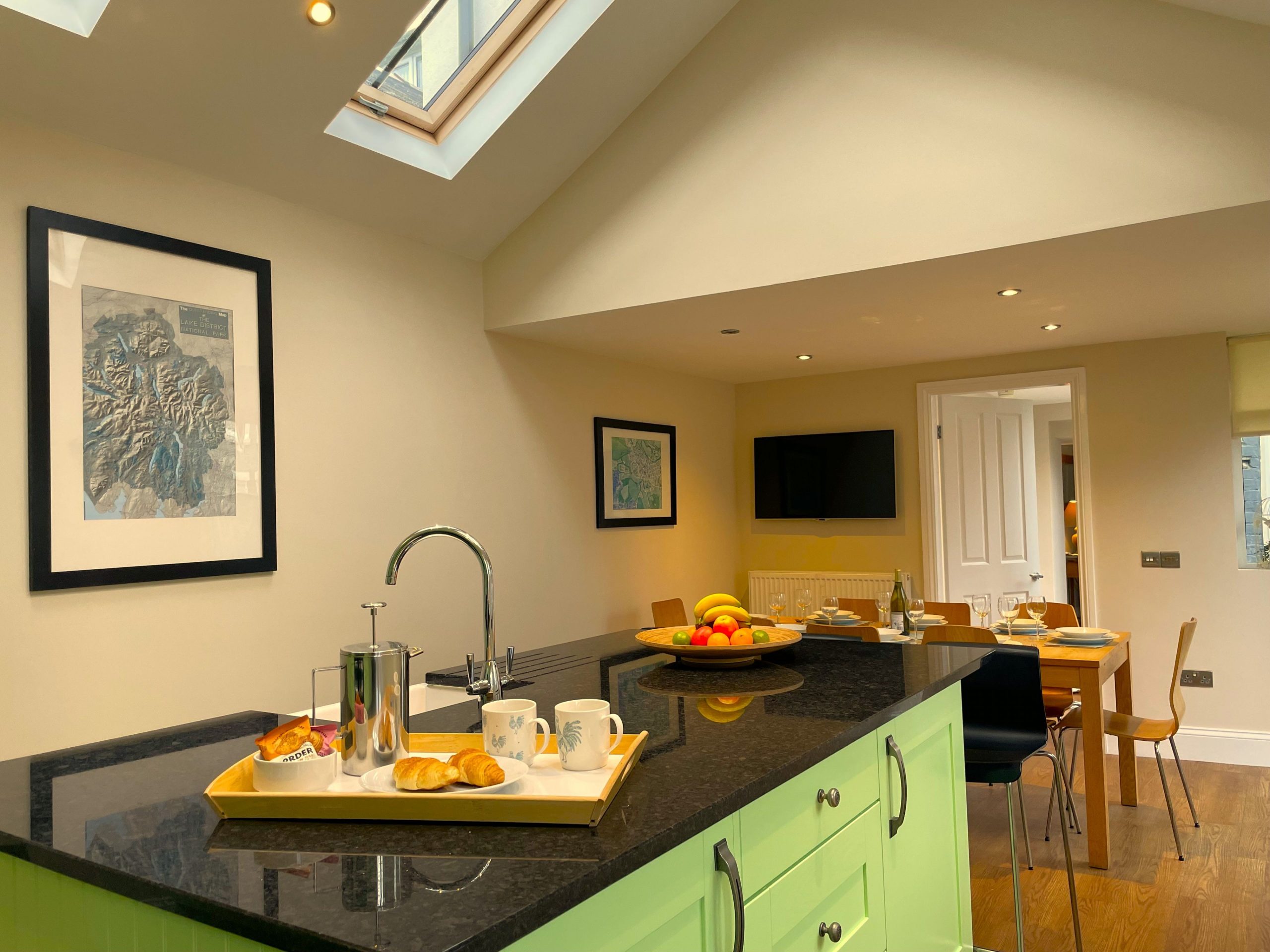 The kitchen and dining area also features a wall mounted smart TV