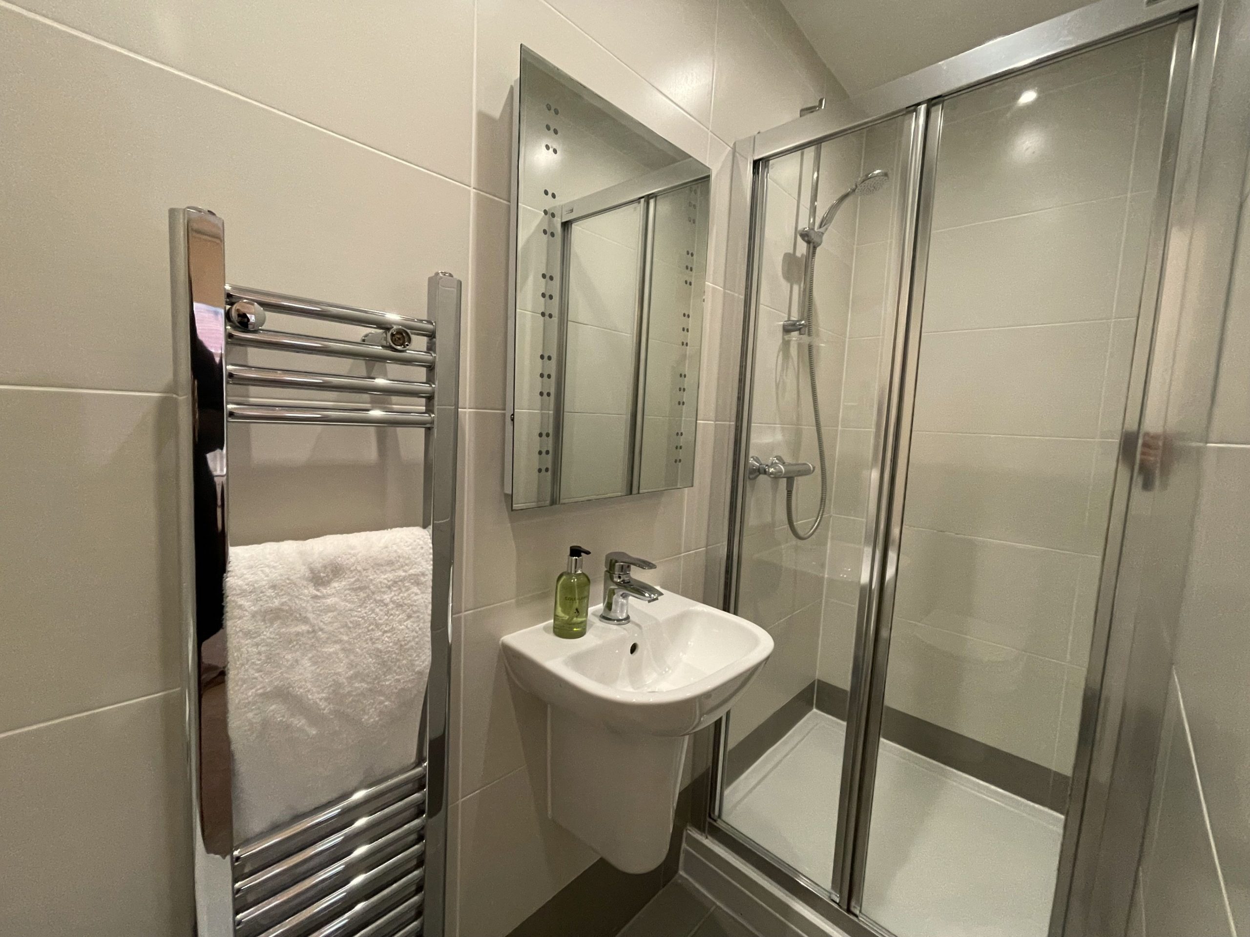 The ensuite comprises walk in shower, sink, WC and heated towel rail