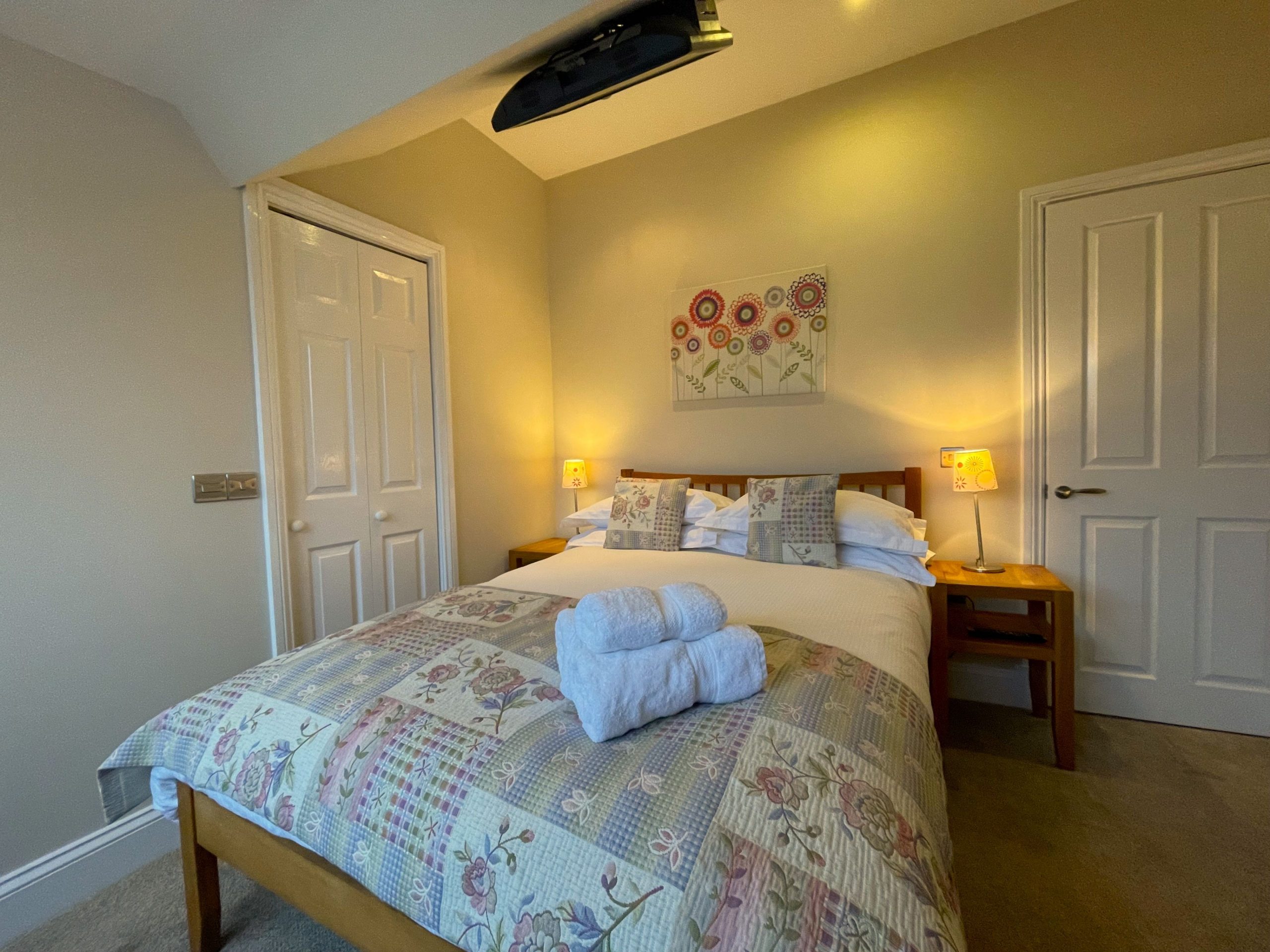 You will also find a ceiling mounted TV and ensuite shower room