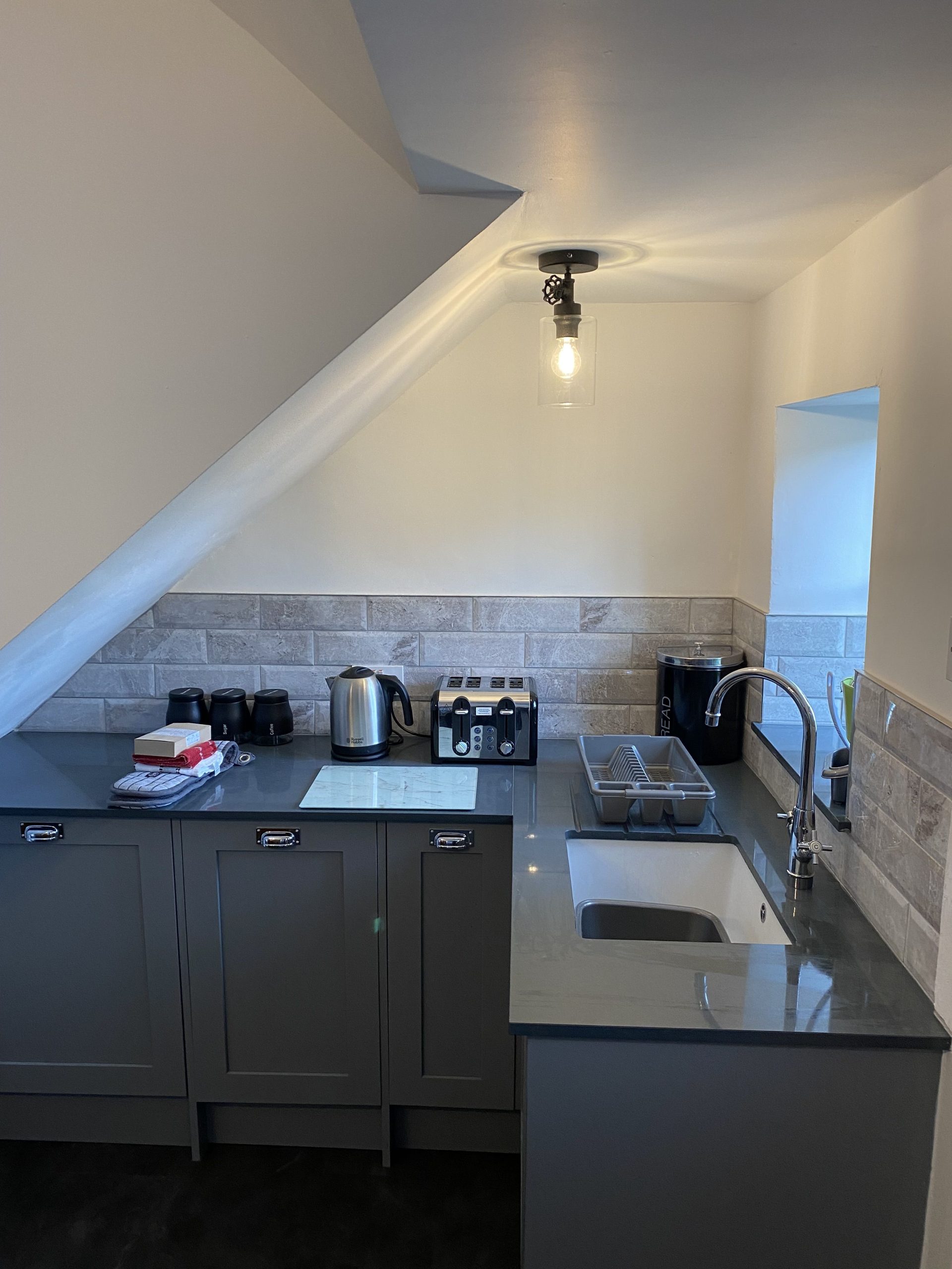 The kitchen has pleasant garden views