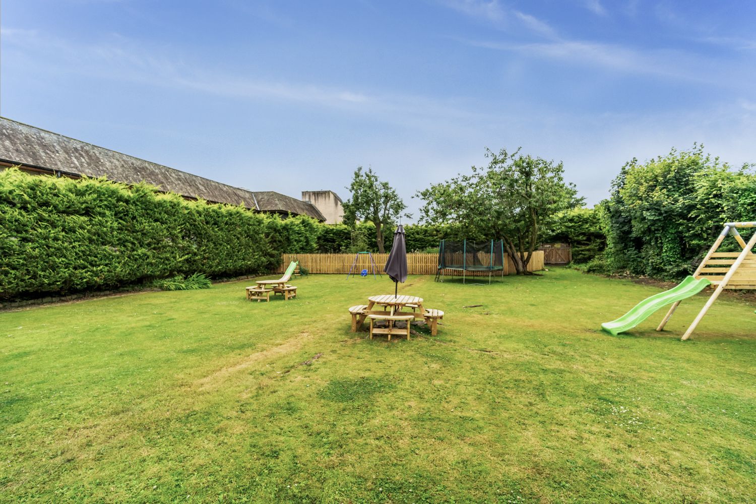 The large enclosed garden is shared with the other holiday properties in the Bridge Complex