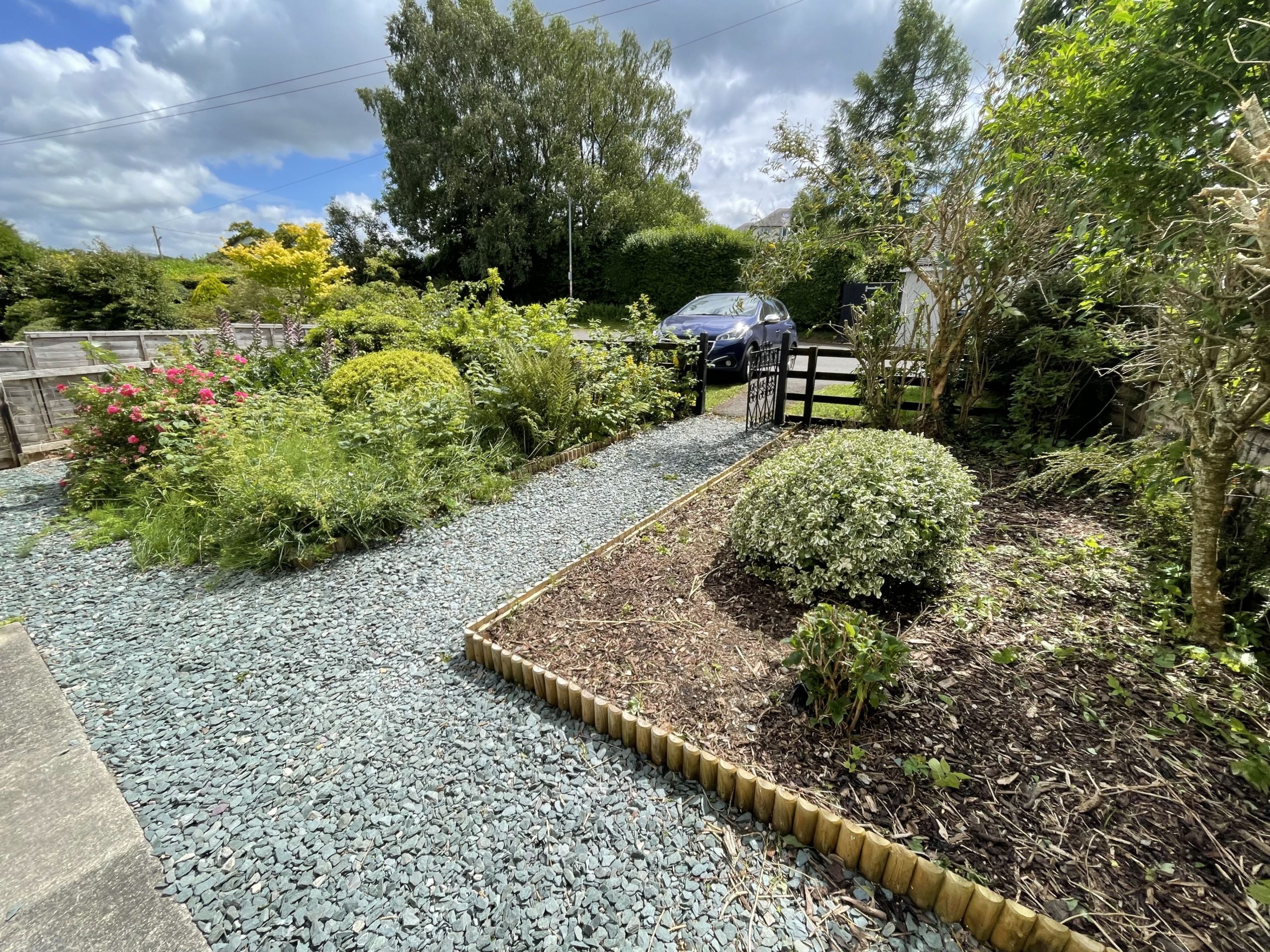 There is space for two cars to park at the front of the property