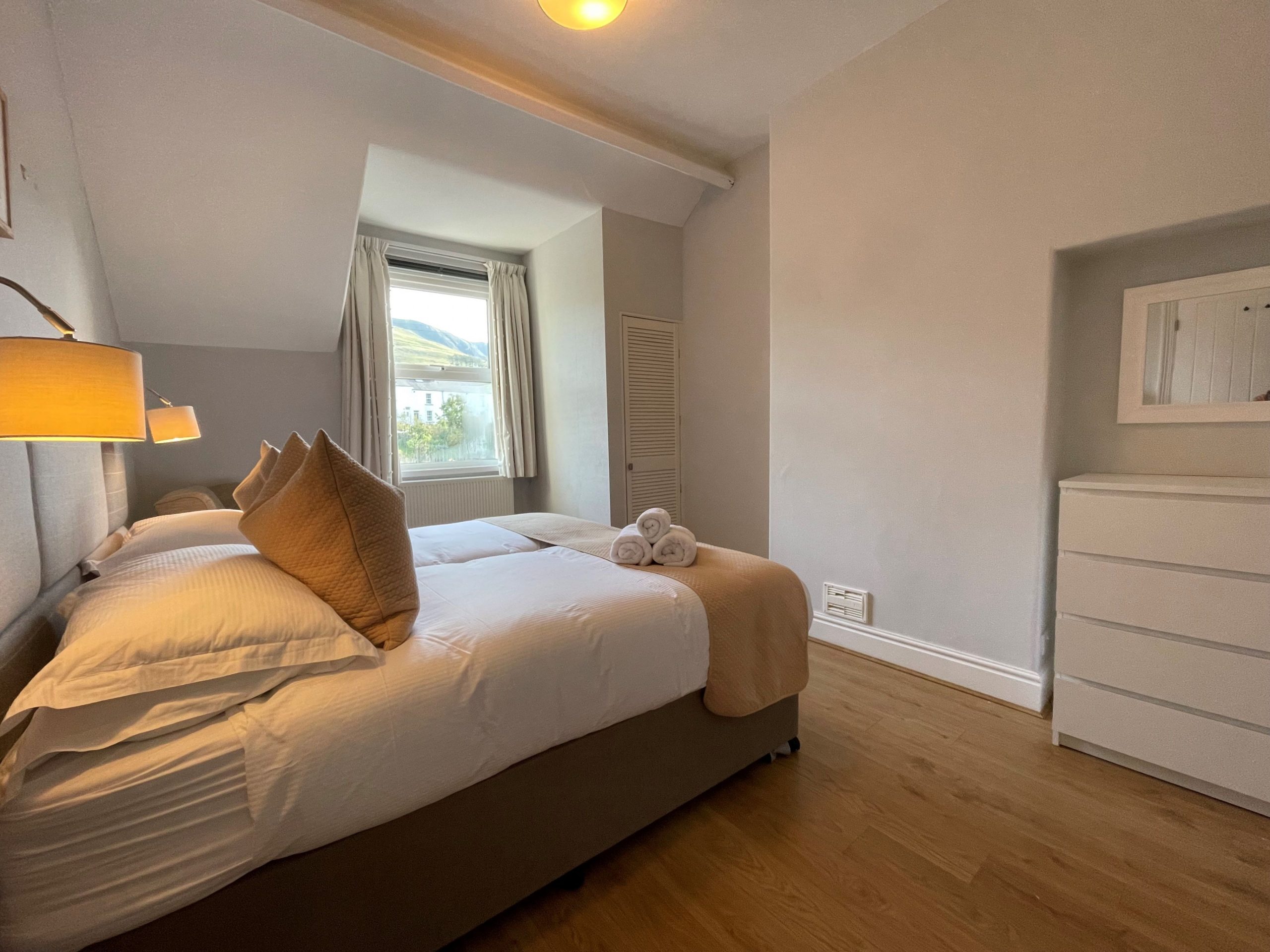 This room is spacious and light and has plenty of storage for your belongings